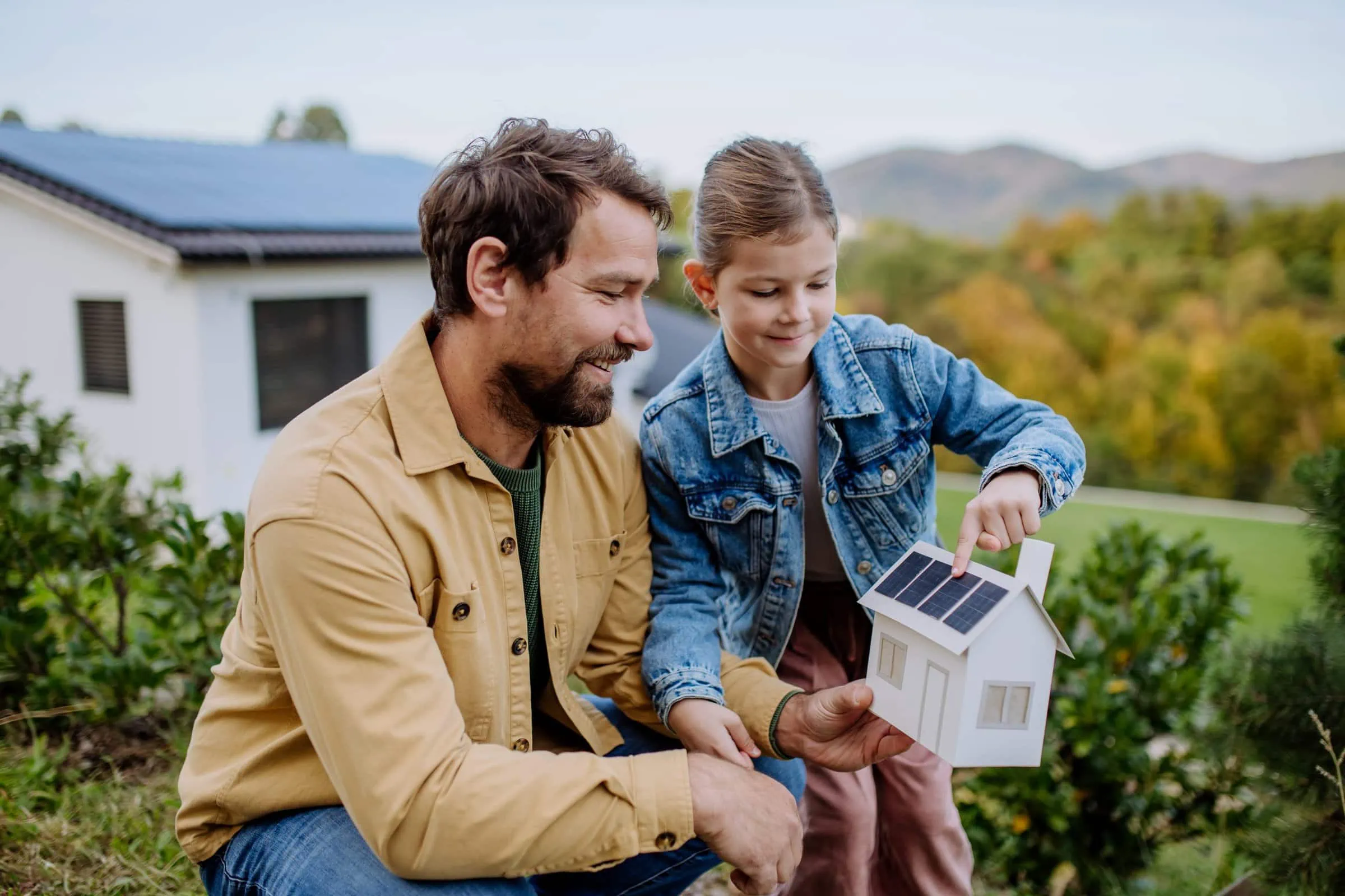 little girl with her dad holding paper model of ho 2022 10 25 21 44 39 utc scaled